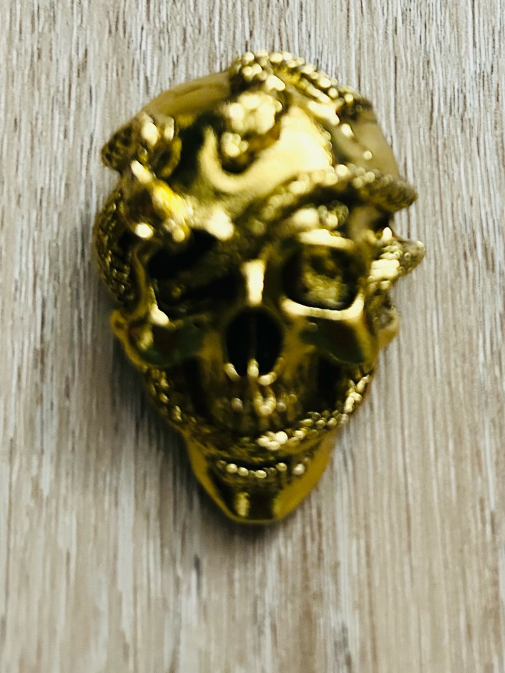 Gold Skull With Snake Brooch